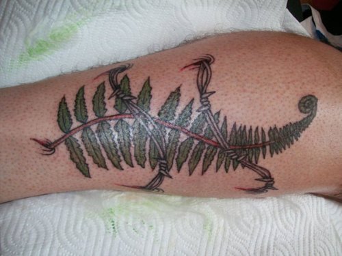 Green Leafs and Barbed Wire Tattoo On Leg